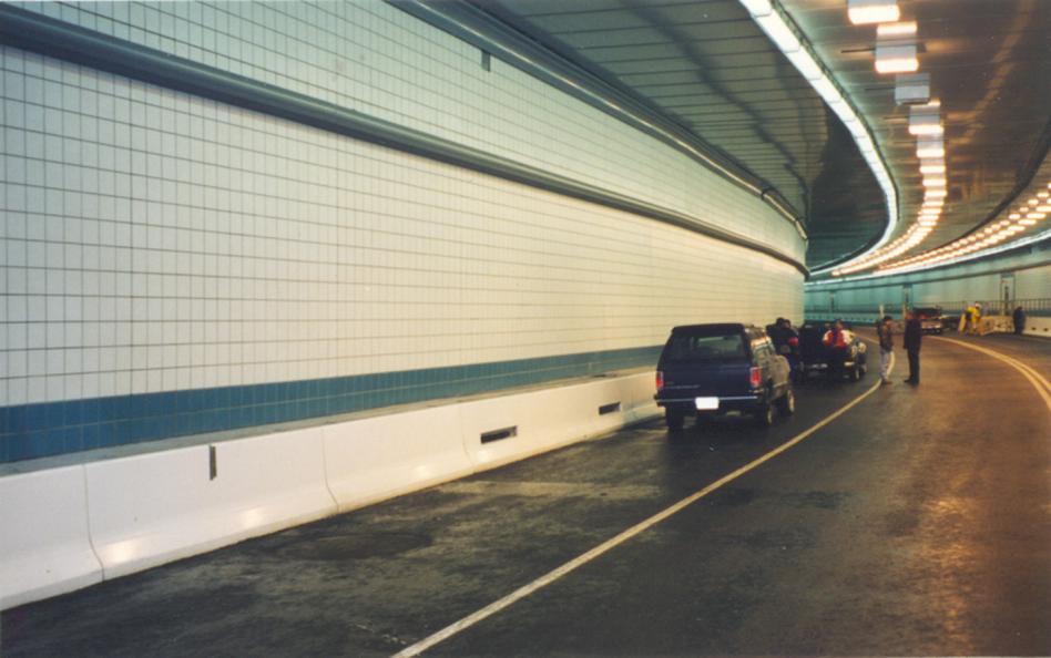 installations have shown that the bright white surface increases the efficiency of the existing tunnel lighting. Fig 4. Precast Polymer Concrete panels used for tunnel bench wall. Table 5.