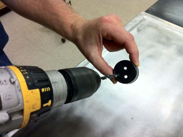 To modify an existing cap, a hole can be drilled into a cap.