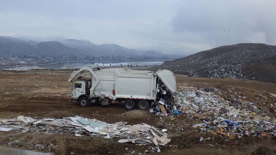 Photo 32. City of Kamloops packer truck depositing waste at the active face of Mission Flats Landfill Barnhartvale Landfill: This small facility is used mainly by residents of the Barnhartvale area.