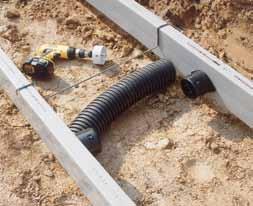 Crossovers connecting inner and outer lineals to facilitate drainage can be made by connecting outlet fittings or adaptors with corrugated pipe.