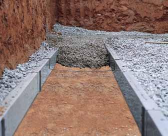 Two-Sided Forming CONCRETE FILL BELOW UNDISTURBED EARTH SURROUNDED BY GRAVEL UNDISTURBED EARTH Raised/Elevated FAD: Low Slump Concrete Depending on the footing depth required, raise the top of the