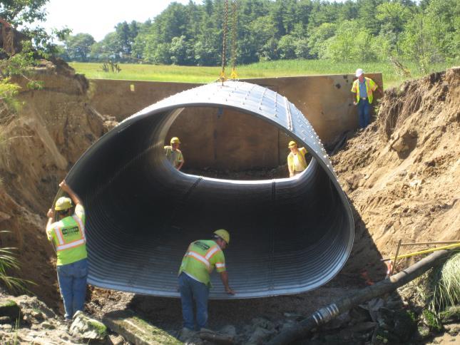 Until recently, tidal inundation of Thomas Bay Marsh upstream of Adams Road was limited by a small culvert. In 2011, several organizations teamed up to install a larger aluminum pipe arch culvert.