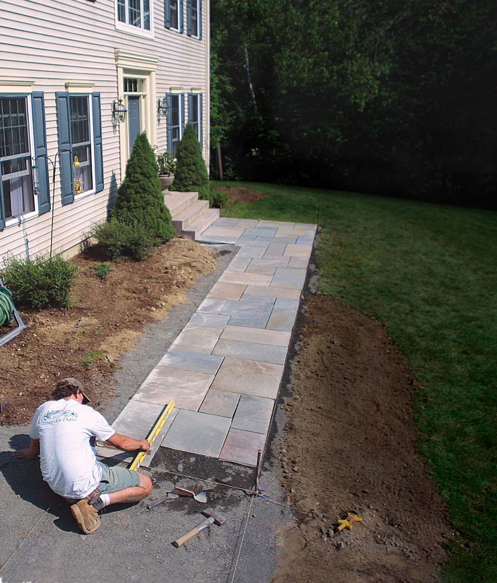 Laying a Flagstone Walkway Setting the stone is the fun part; preparing a solid base first will make the walk last BY ERIC NELSON Every house needs a walk.