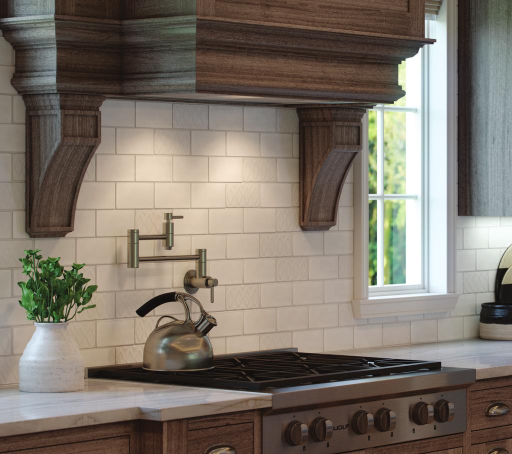 Cover and above photos feature RetroSpace Modern White wall tile and diamond accent on the backsplash with Natural Quartzite Tahitian Cream on the countertops.