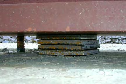 Steel shims are used to get the steel columns to the correct