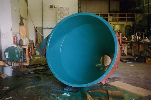 Part of a grit blasting reclaim system sprayed with green