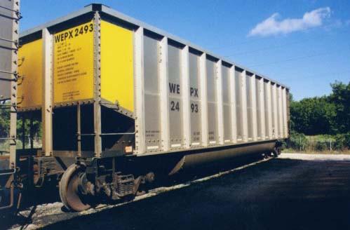 Rotary dump rail cars sprayed with black OR70SS on the interior bottoms to