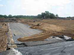 The majority of the waste stockpile has been covered with soil and seeded, and has had an erosion-control blanket placed on it.