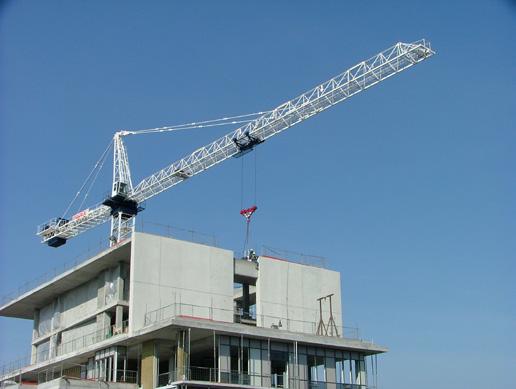CHAPTER 3 Manufacturing, Transportation and Installation Erection of a precast panel using a tower crane.