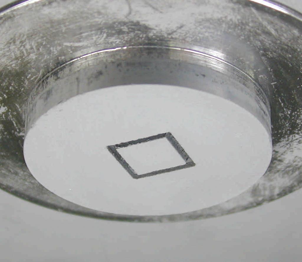 By removing the unnecessary parts, the final green cube was obtained (Figure 5c). The cube was easily separated by remelting the wax in the grooves.