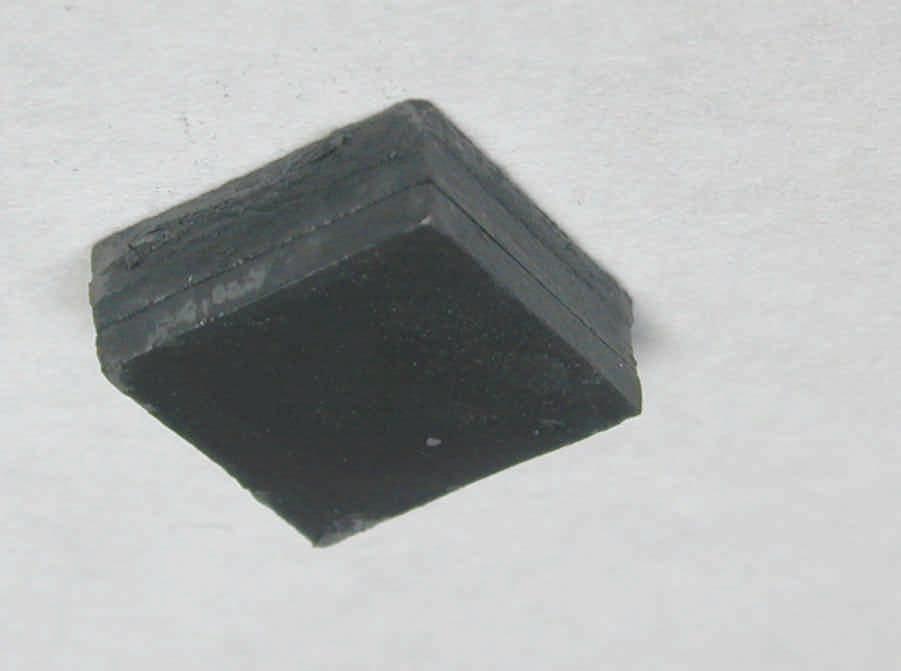 Compacted powder Unnecessary part Grooves Layered compaction Model part Separation of model Layered direction Paraffin wax (a) (b) (c) Figure 5. WC-9wt%Co green cube fabricated using the LCM process.