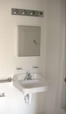 located over the accessible lavatory bottom edge of the reflecting surface 40