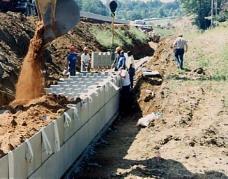 This procedure will fill both sides equally and prevent lateral movement of the unit. Placing the backfill Do not stack the units more than one unit high without backfilling.