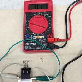 Switch the multimeter setting to DCV (Direct Current Voltage) to measure the voltage of