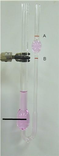 Viscosity Testing - Kinematic Cross arm tube with timing marks & filled with asphalt.