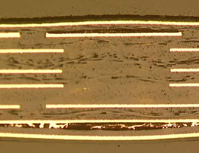 At this point, or during the subsequent solder-wave application, the dielectric bonding can fail due to delamination.