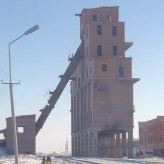 Figure 5 Administrative building (left) and entrance to the vertical shaft of the Nalaikh coal mining plant with ventilation hollows (right) 5.