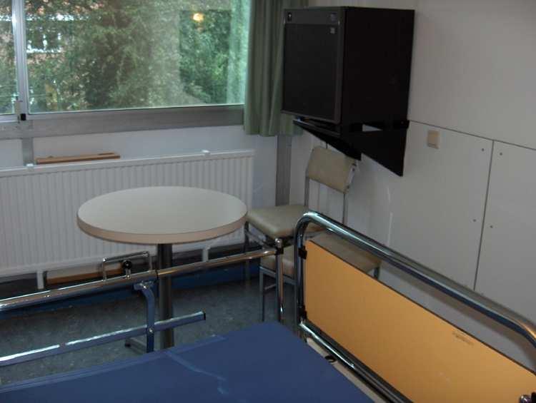 Hospital, B Building, 3 rd floor): Standard hospital room with 1 bed, night table, chair