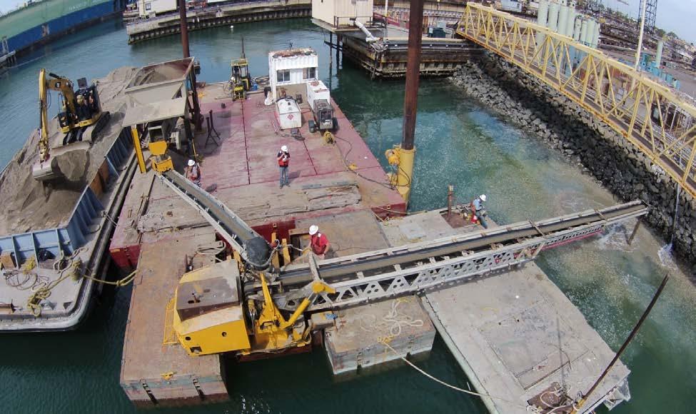 RES developed a floating telli-belt conveyor system that discharged sand between the pier piles at a specified rate called out by the contract.