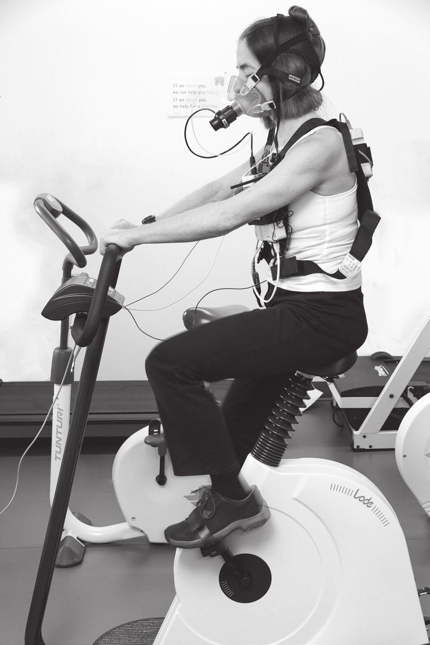 6 (c) Fig. 2.1 shows a woman on a stationary bicycle. The mask fitted over her nose and mouth measures the composition of the air she breathes out. Fig. 2.1 Fig. 2.2 shows the concentration of carbon dioxide in the air expired by the woman in the five minutes after she stopped exercising.