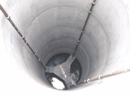 pad/platform; drill shaft using casing, support fluid as required; incrementally install manhole rings; tremie base slab/seal at base; stage grout