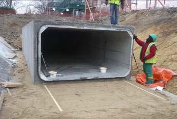 If the ground is suitable (this will be the responsibility of the trench designer) culverts could be laid directly on to compacted soil, again using a blind of dry sand and cement.