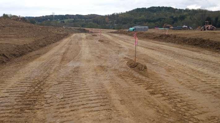 Road grading and controlling runoff