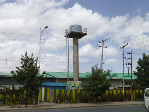 1.3 How water gets to peope iving in towns Figure 1.12 A water tower in Addis Ababa. From the service reservoir, the water is taken by distribution mains to different areas.