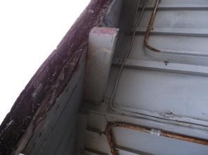 Third, the wood panels of the buildings soffits need repair and replacement, as they have rotted.