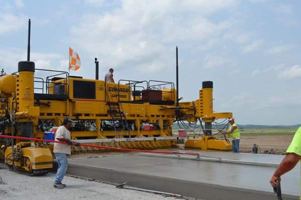Already being done at numerous airports around the country 501-4.8 Placing concrete. -- a. Slip-form construction.