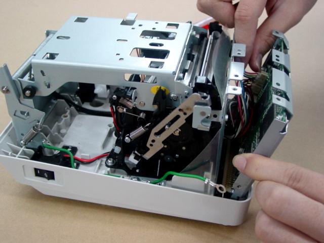 1. Remove the four 3x6 s-tite screws which secure the PCB Cage to the Print