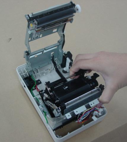 NOTE: When removing the screw, be careful not to touch the print head elements with the
