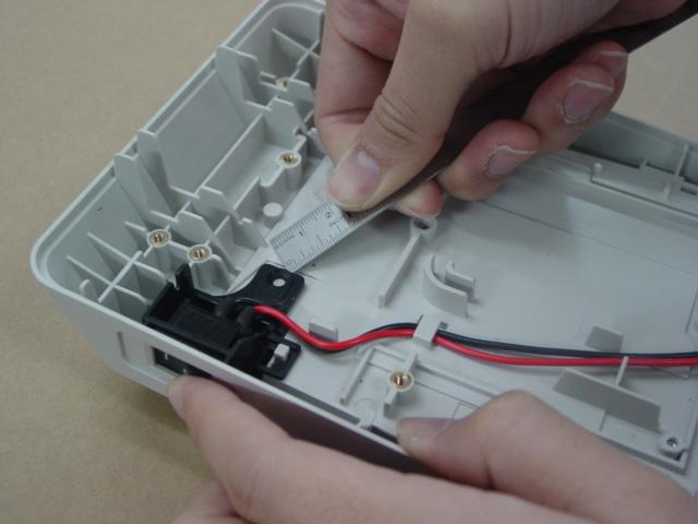 Remove the Power switch block from the Cover Bottom by using any small flat object (for example: tweezers