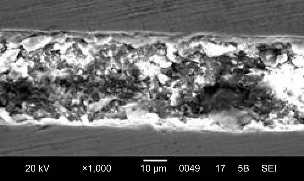 Figure 11. SEM photograph of diffusion bonded Ti-Cu plates (at 973 K, 2 hours at 250 N). region of different intermetallics and a region of eutectic mixture of Ti (Figure 11).