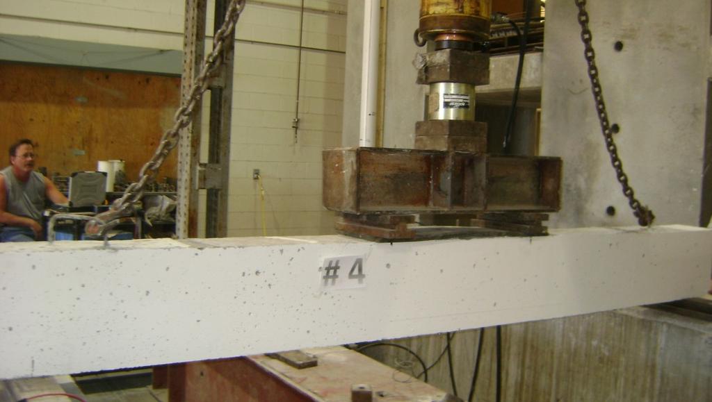 Test Setup and Procedures Figure 6 shows the test setup of the specimen. Two-point load was applied using hydraulic jack, load cell, and two roller supports.