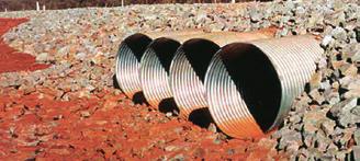 They are easily widened with added rings and their surfaces, with multiple layers of engineered backfill just below the running surface, withstand the wear of heavy vehicles without the costly