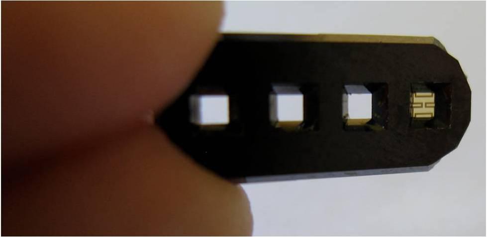 Surface micromachining is used to pattern the backside as well as to create a metal electronic sensing circuit on the frontside of the wafer.