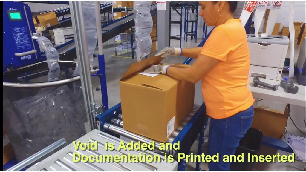 Cartons (passed weight audit) divert to the Readyship in-line void-seal-pack sheet