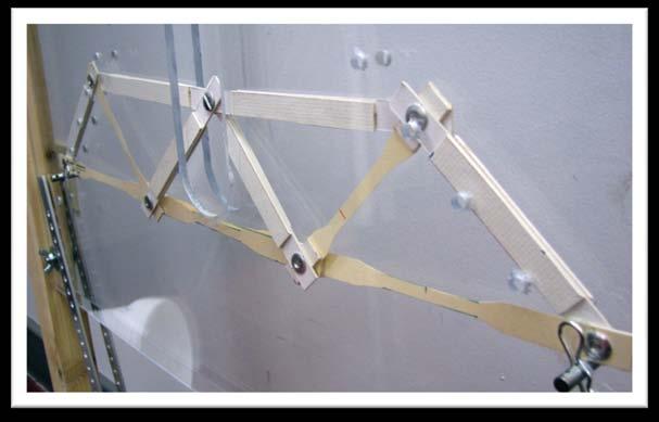 Figure 6. Paper truss loaded in a hanging weight truss tester. Figure 7.