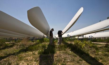 1.1 China-Wind Power Equipment Workers paint wind turbine blades at