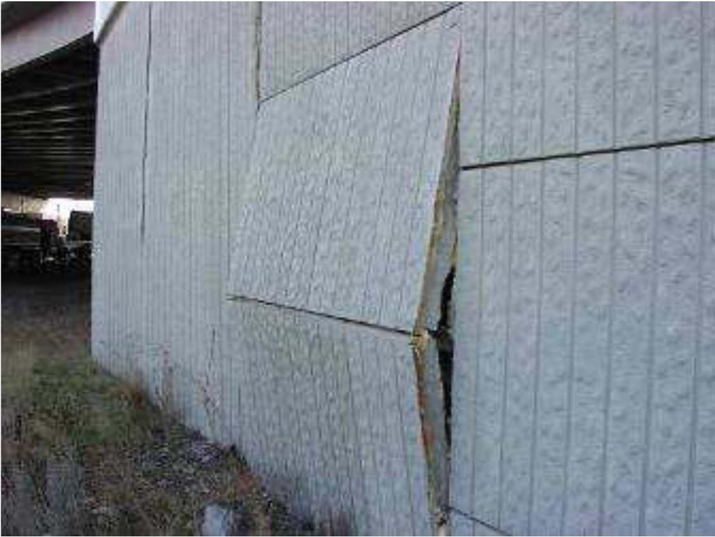 Bowing of the Wall Bowing caused by failure of reinforcement connections.