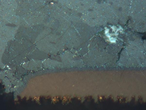 Crack Figure 10. Cross-polarized light micrograph showing apparent recrystallization and grain-boundary cracking near the PCB pad in a SAC105 ball alloy solder joint subjected to 4628 thermal cycles.