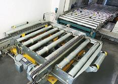 240 unit loads/hour Transfer of load from roller to chain conveyor, or vice-versa in other direction.