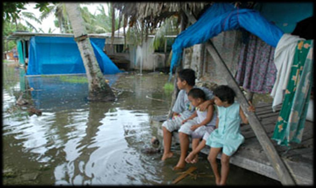 Tuvaluan kids hang out as extra high tide