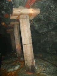 Figure 3: A combination of roof bolts and pre-stressed mine poles installed as face support at a local deep level gold mine 5.