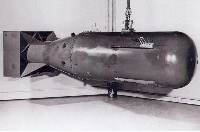 A hollowed uranium donut is fired onto a uranium spike. The bomb contained a total of 64 kg of Uranium. A total of 0.