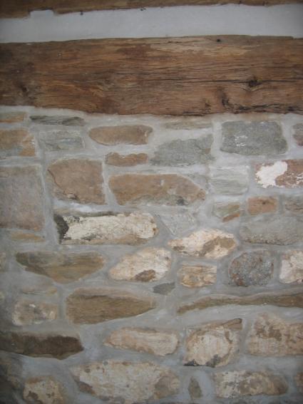 Foundations. Traditional foundations in Hillsboro include stone, brick, and parged surfaces. The most common type is rubble-coursed fieldstone, as shown in the example.