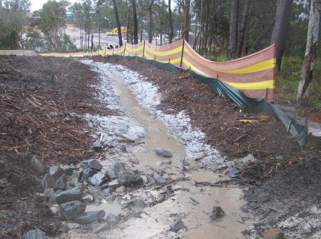 contaminating the clean stormwater or causing erosion. Photo 13: Managing site hydrology - Substantially compliant.