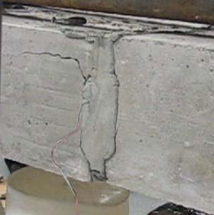 left end of the curved bolt. Figure 31(a) shows the initial cracking around the curved bolt after the post tensioning is applied.