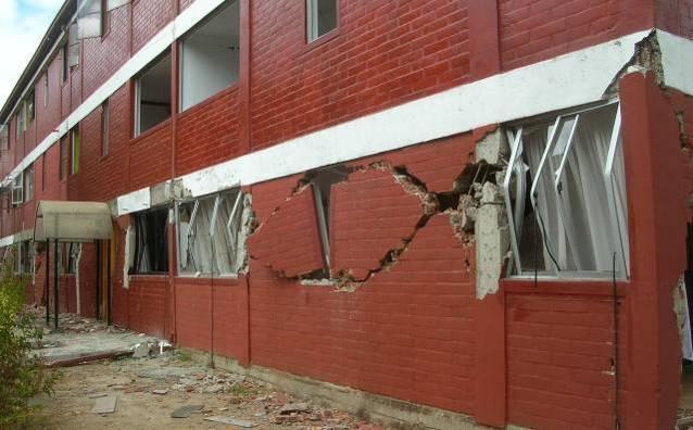 Seismic Design Guide for Low-Rise Confined Masonry Buildings a) b) Figure 12. In-plane shear failure of poorly confined masonry walls: a) the 2010 Maule, Chile earthquake (M.